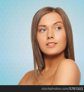 beauty, people and health concept - beautiful young woman with bare shoulders over blue background