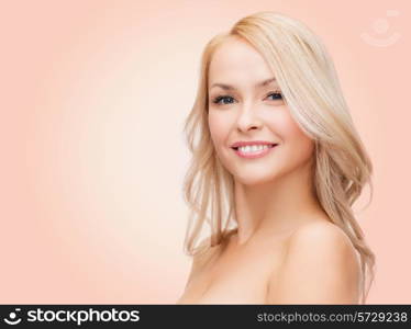 beauty, people and health concept - beautiful young woman with bare shoulders over pink background