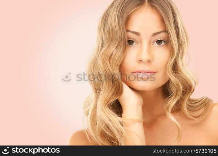 beauty, people and health concept - beautiful young woman with bare shoulders over pink background