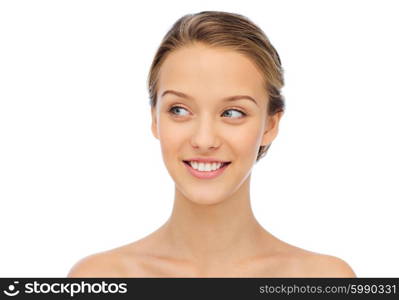 beauty, people and health concept - smiling young woman face and shoulders