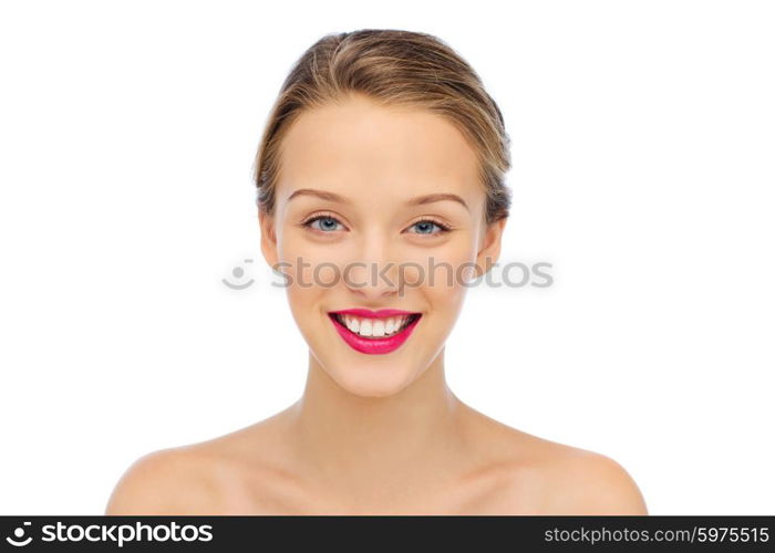 beauty, people and health concept - smiling young woman face with pink lipstick on lips and shoulders