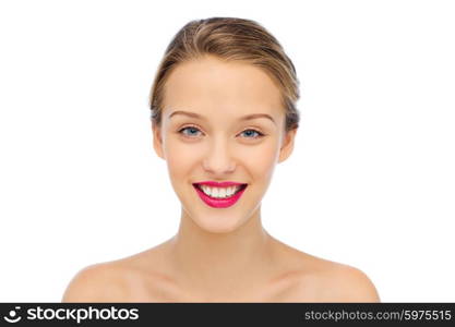 beauty, people and health concept - smiling young woman face with pink lipstick on lips and shoulders