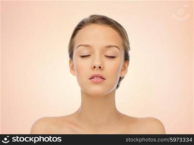 beauty, people and health concept - young woman face with closed eyes and shoulders over beige background