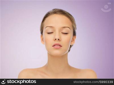 beauty, people and health concept - young woman face with closed eyes and shoulders over violet background