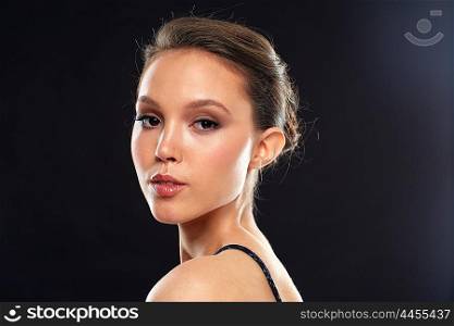 beauty, people and luxury concept - beautiful young asian woman over black background