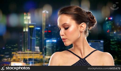 beauty, people and luxury concept - beautiful young asian woman over singapore city night lights background