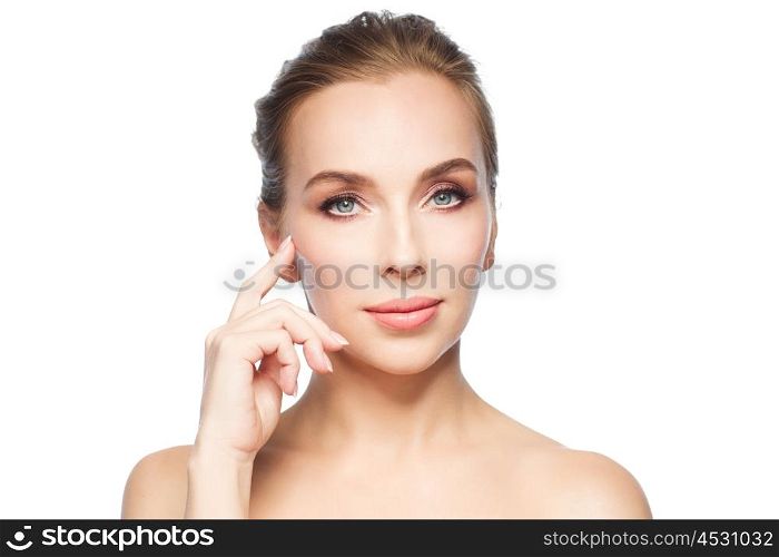 beauty, people and plastic surgery concept - beautiful young woman showing her cheekbone over white background