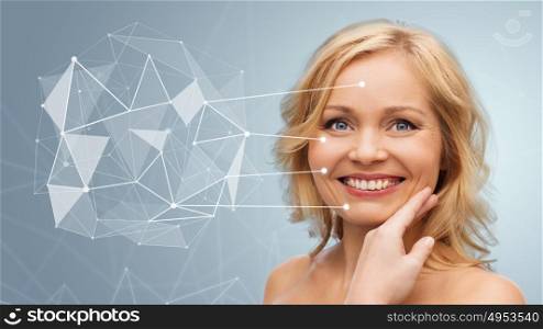 beauty, people and skincare concept - smiling woman with bare shoulders touching face over gray background with low poly projection and pointers. smiling woman with bare shoulders touching face