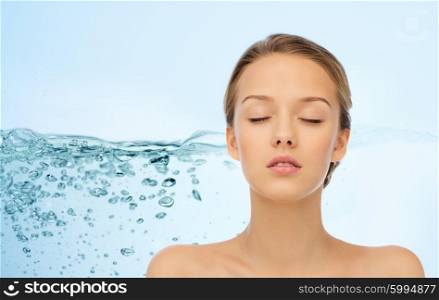 beauty, people, moisturizing, skin care and health concept - young woman face with closed eyes and shoulders over water splash background