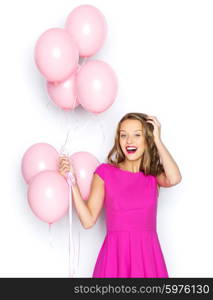 beauty, people, style, holidays and fashion concept - happy young woman or teen girl in pink dress with helium air balloons