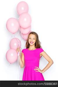 beauty, people, style, holidays and fashion concept - happy young woman or teen girl in pink dress with helium air balloons