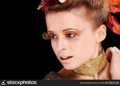 Beauty photo of woman with autumn makeup over black background
