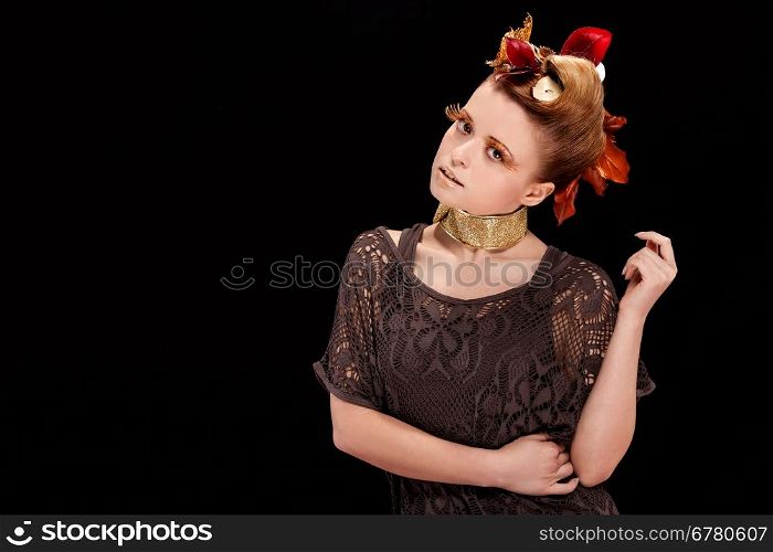 Beauty photo of woman with autumn makeup over black background