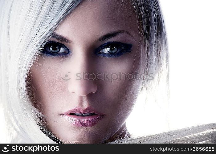 beauty portrait of a cute blond girl with long hair and forced color