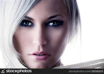 beauty portrait of a cute blond girl with long hair and forced color