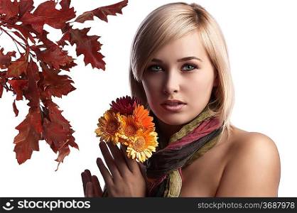beauty portrait of a natural looking blonde with flowers in her hand