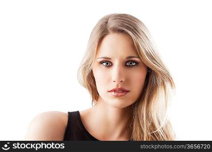 beauty portrait of a young and beautiful blond girl with long hair and natural make up posing over white, she is in front of the camera and loks in to the lens