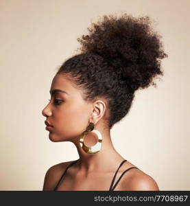 Beauty portrait of African American girl with afro hair. Beautiful black woman. Cosmetics, makeup and fashion