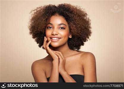 Beauty portrait of African American girl with afro hair. Beautiful black woman. Cosmetics, makeup and fashion