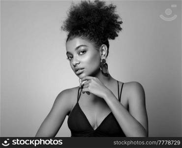 Beauty portrait of African American girl with afro hair. Beautiful black woman. Cosmetics, makeup and fashion. Black and White photo