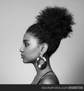 Beauty portrait of African American girl with afro hair. Beautiful black woman. Cosmetics, makeup and fashion. Fashionable black and white photography