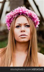 Beauty portrait of attractive blond girl with a beautiful pink headband