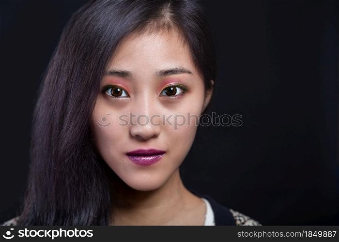 Beauty portrait of beautiful Asian American fashion model in makeup