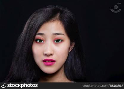 Beauty portrait of beautiful Asian American fashion model in makeup