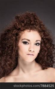 beauty portrait of curly hair woman with smooth makup