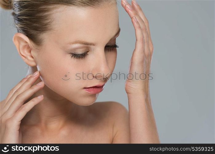 Beauty portrait of girl smelling perfume on wrist