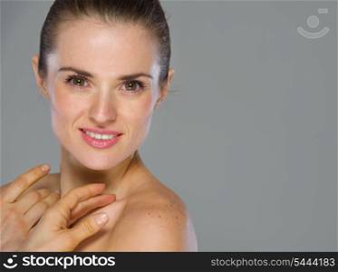 Beauty portrait of happy young woman isolated on gray background