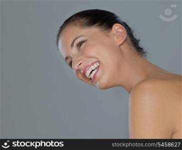 Beauty portrait of smiling girl on gray background