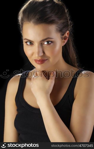 Beauty portrait of young attractive woman, isolated on dark studio