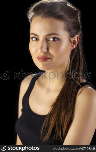 Beauty portrait of young attractive woman, isolated on dark studio