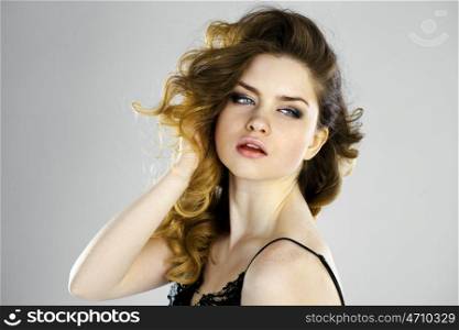 Beauty portrait of young attractive woman, isolated on gray background