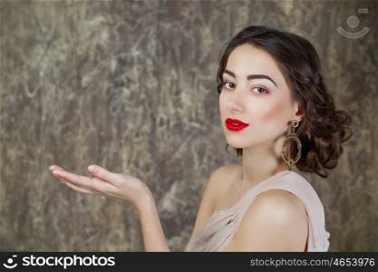 Beauty portrait of young attractive woman on dark studio wall