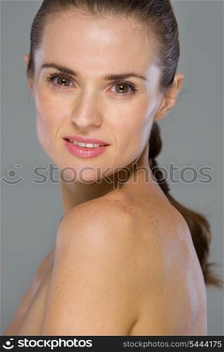 Beauty portrait of young woman isolated on gray background