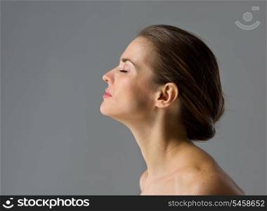 Beauty portrait of young woman isolated on gray background