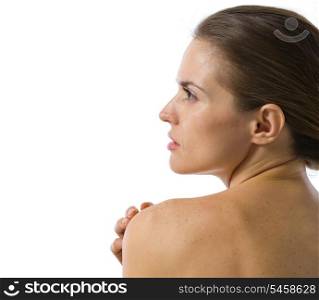 Beauty portrait of young woman looking on copy space . rear view