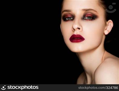 Beauty portrait red eyes and lips makeup model on black background