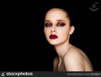 Beauty portrait red eyes and lips makeup model on black background