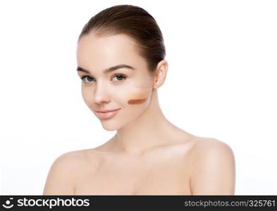 Beauty portrait with foundation stripes different tone makeup on white background