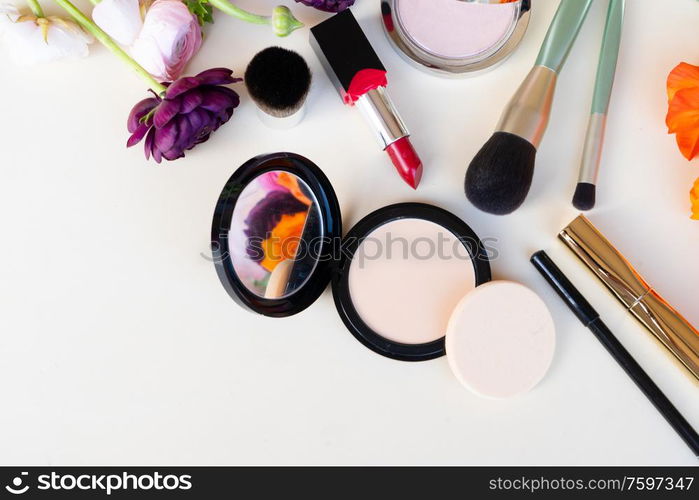 beauty products with flowers, top view border on pink. beauty products with flowers