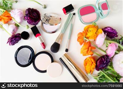 beauty products with flowers, top view on pink. beauty products with flowers