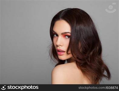 Beauty red eyes and lips makeup fashion model on grey background