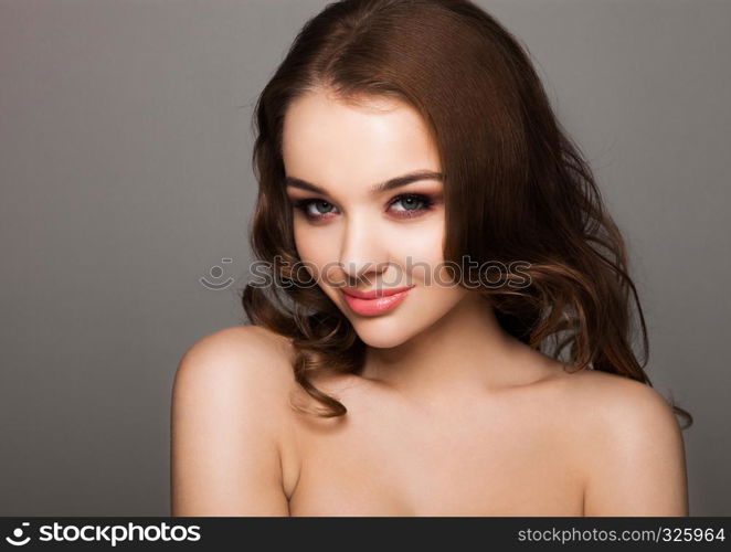 Beauty red eyes pink lips makeup fashion model on grey background