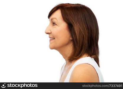 beauty, rhinoplasty and old people concept - profile of smiling senior woman over white background. profile of smiling senior woman over white