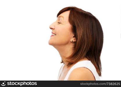 beauty, rhinoplasty and old people concept - profile of smiling senior woman over white background. profile of smiling senior woman over white