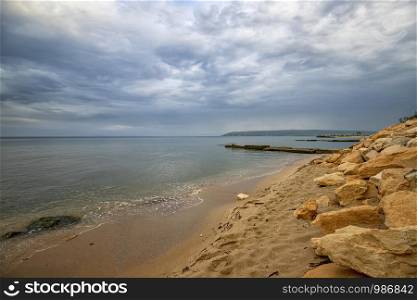 Beauty sea rocky coast with many stones on the shore. Black sea. Varna, Bulgaria