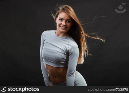 Beauty seducive shape fit body concept. Attractive girl posing. Youthful smiling lady presenting thermoactive clothing showing fitness fashion.. Sport fit woman in thermal clothes.